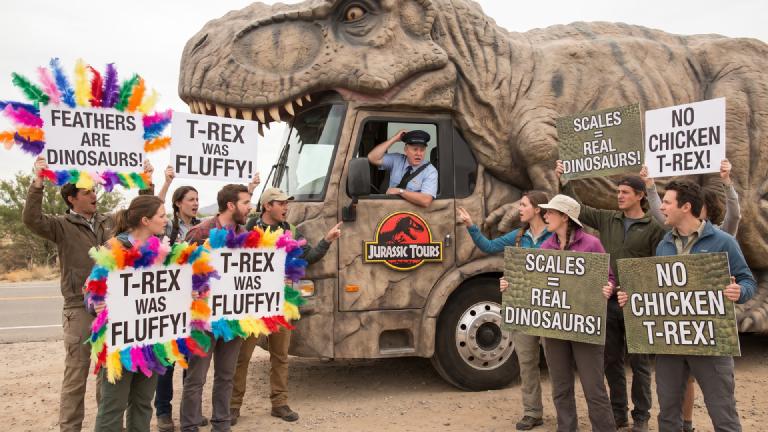 "Monthly Paleontology Bus" Review Section Erupts into Civil War over T-Rex Feather Depiction; Editorial Department Declares "Buses Are on Schedule"